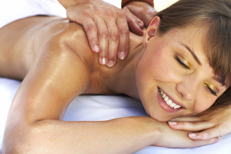Happy Woman Receiving Swedish Massage